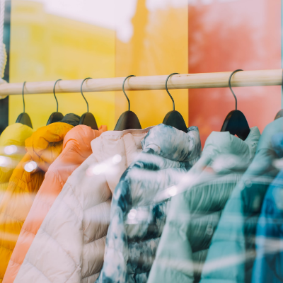 Puffer jackets hanging on a rail